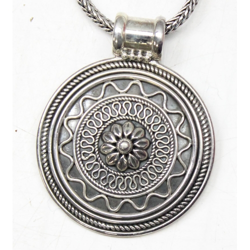 1131 - Silver circular pendant on chain marked 925, gross weight approx 36.56g