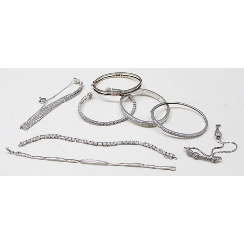 1133 - 8 silver bracelets/bangles all XRF tested 92.5% or above, all set with crystal, gross weight approx ... 