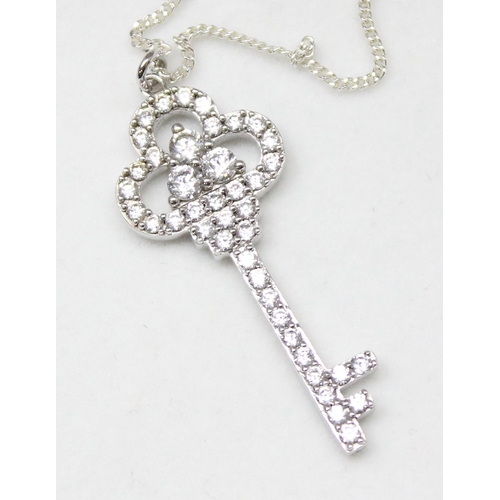 1148 - 4 silver necklaces to include Hamsa design and key pendant, gross weight approx. 21.91g