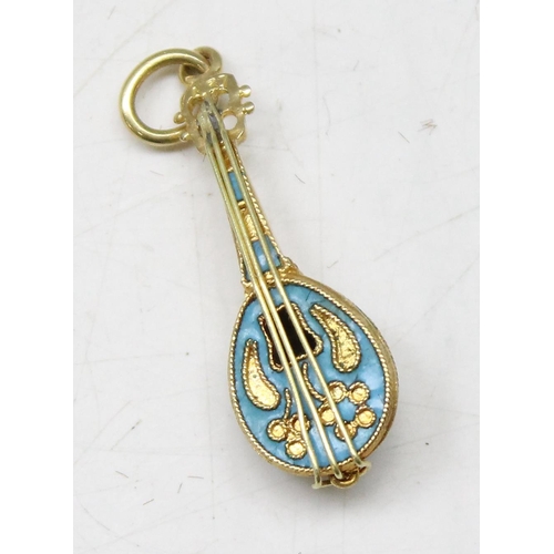 1162 - An 18ct gold and enamel pendant formed as a mandolin, approx 2.72g gross