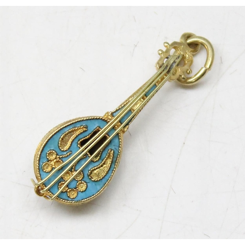 1162 - An 18ct gold and enamel pendant formed as a mandolin, approx 2.72g gross