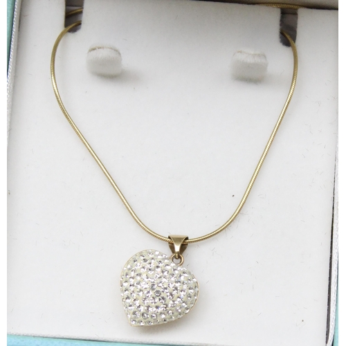 1169 - 9ct gold heart shaped and white stone set pendant on 9ct gold chain, chain approx 44cm long, approx ... 