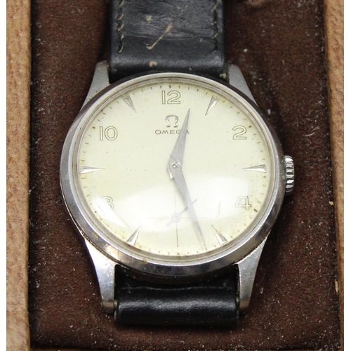 1301 - A 1950's Omega wristwatch in stainless steel case, the dial with baton odd numerals and even Arabic ... 