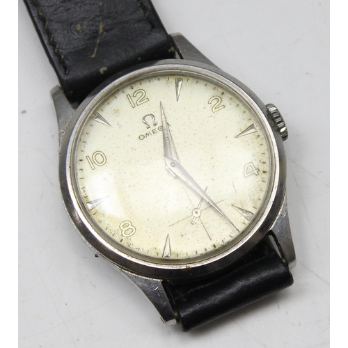 1301 - A 1950's Omega wristwatch in stainless steel case, the dial with baton odd numerals and even Arabic ... 