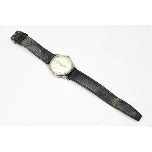 1301 - A 1950's Omega wristwatch in stainless steel case, the dial with baton odd numerals and even Arabic ... 