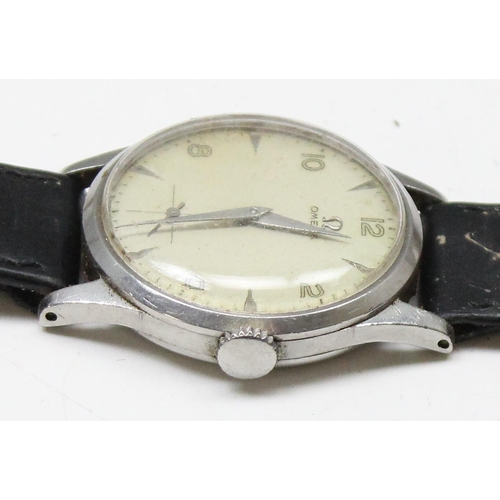 1301 - A 1950's Omega wristwatch in stainless steel case, the dial with baton odd numerals and even Arabic ... 