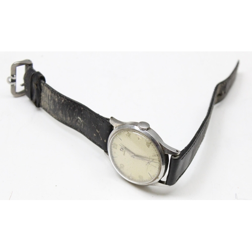 1301 - A 1950's Omega wristwatch in stainless steel case, the dial with baton odd numerals and even Arabic ... 