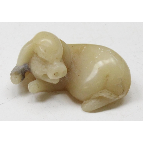 1605 - A Chinese carved soapstone figure of a recumbent pig, likely 19th century, approx 50mm wide