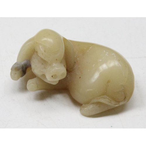 1605 - A Chinese carved soapstone figure of a recumbent pig, likely 19th century, approx 50mm wide