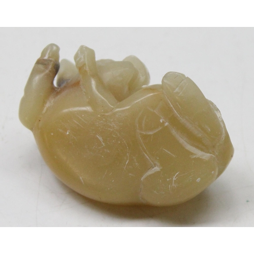 1605 - A Chinese carved soapstone figure of a recumbent pig, likely 19th century, approx 50mm wide