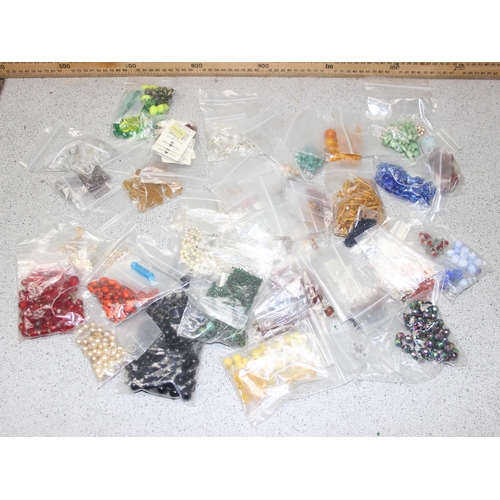 1180 - A large qty of assorted loose costume jewellery beads sorted into types