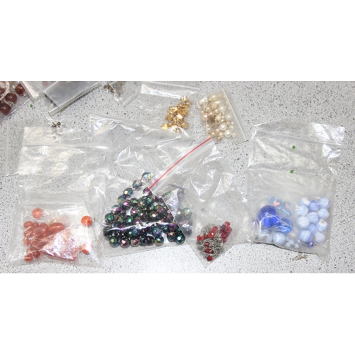 1180 - A large qty of assorted loose costume jewellery beads sorted into types