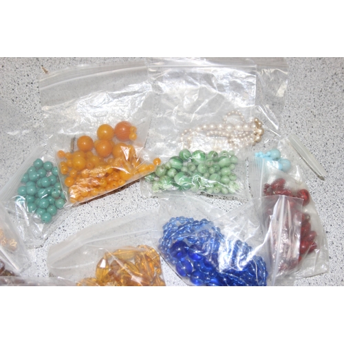 1180 - A large qty of assorted loose costume jewellery beads sorted into types