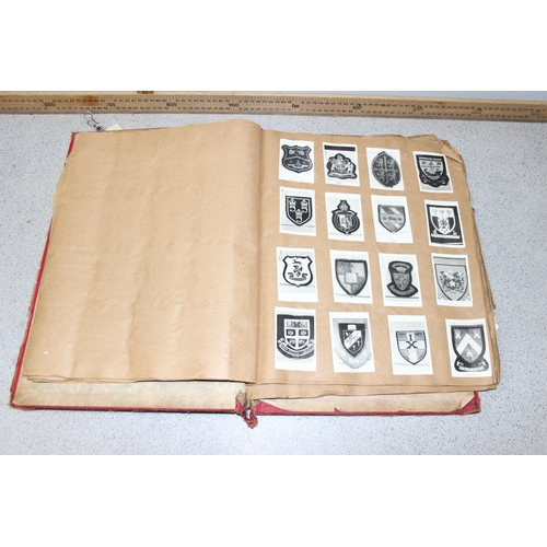 1417 - Antique scrapbook and contents, mainly military crests