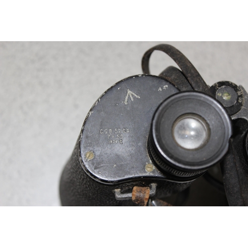 1416 - A pair of War Department marked 7x50 binoculars by REL of Canada 1943, a large brass shell case and ... 