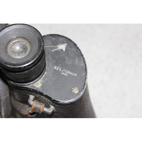 1416 - A pair of War Department marked 7x50 binoculars by REL of Canada 1943, a large brass shell case and ... 