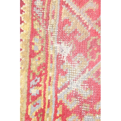 215 - A vintage red ground runner rug, likely Turkish, approx 360cm x 94cm