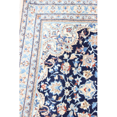 219 - An extremely finely woven Persian Isfahan rug of cream and blue ground, possibly silk, 20th century,... 