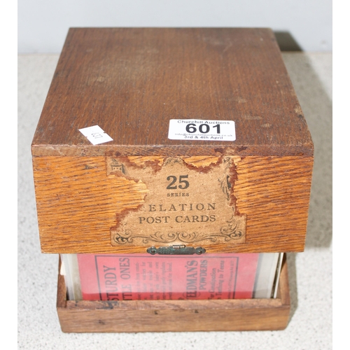 601 - Qty of vintage postcards in wooden box, written and unwritten. Varying dates from 1906 - 50's & 60's