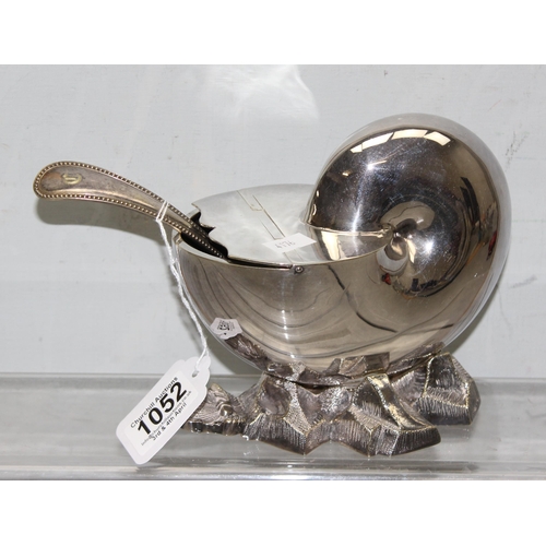 1052 - An antique silver plated spoon warmer formed as a Nautilus shell, with associated antique ladle, app... 