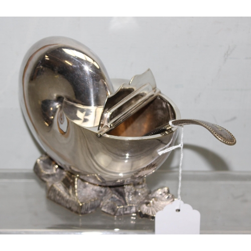 1052 - An antique silver plated spoon warmer formed as a Nautilus shell, with associated antique ladle, app... 