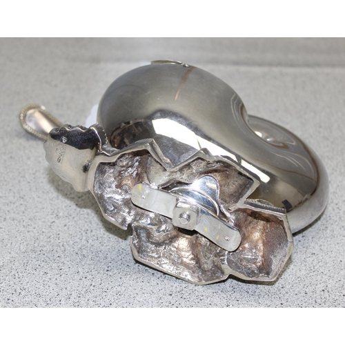 1052 - An antique silver plated spoon warmer formed as a Nautilus shell, with associated antique ladle, app... 