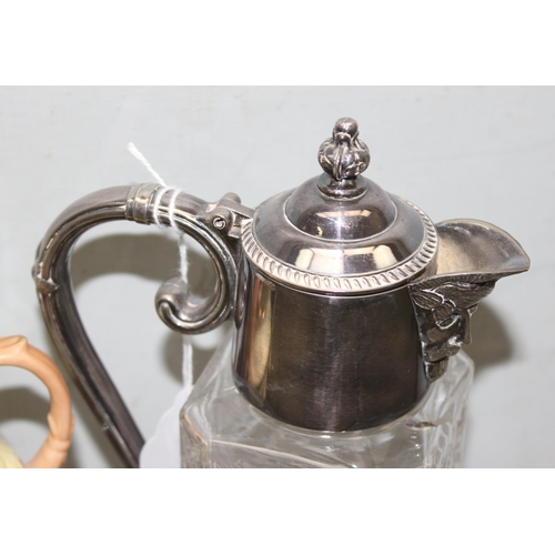 1053 - A silver plated and glass lidded claret jug and a Locke & Co of Worcester jug and sugar shaker on si... 