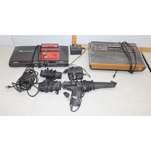 1542 - Sega Master system with Safari Hunt game, gun and 2 controllers and an Atari console