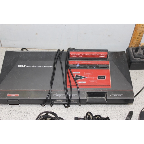 1542 - Sega Master system with Safari Hunt game, gun and 2 controllers and an Atari console