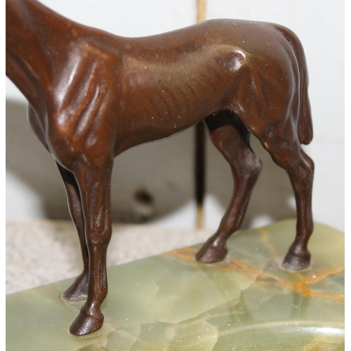 1679 - An early 20th century alabaster ashtray with mounted with a cold painted spelter model of a horse, m... 