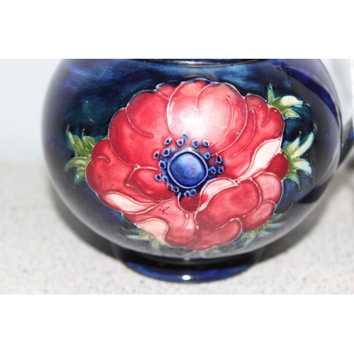 1681 - A vintage Moorcroft Anemone pattern jug, approx 12cm tall