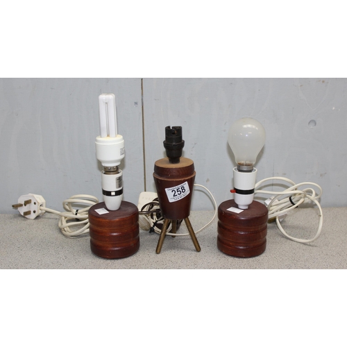 258 - 3 vintage wooden lamps, 1 on tripod base.