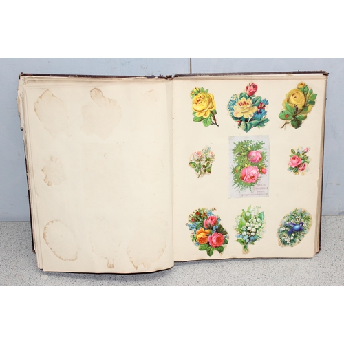 596 - A 19th century scrapbook with a large qty of scraps, mainly animals etc