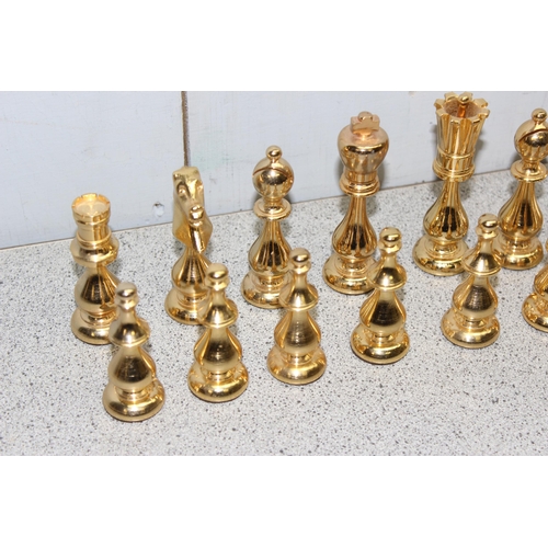 1535 - An unusual good quality gilt metal chess set, the king approx 10.5cm tall