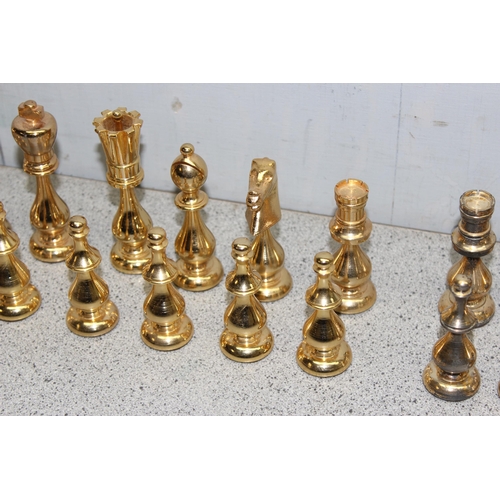 1535 - An unusual good quality gilt metal chess set, the king approx 10.5cm tall