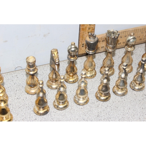 1535 - An unusual good quality gilt metal chess set, the king approx 10.5cm tall