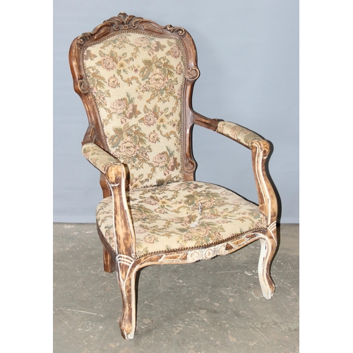 128 - A 19th century style fauteuil chair with distressed wooden frame and floral upholstery