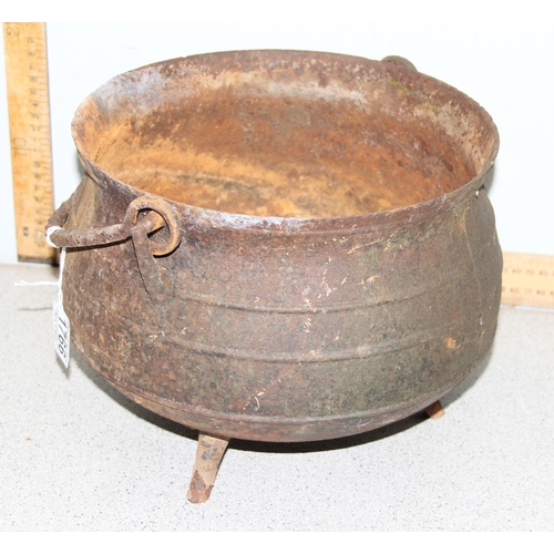 342 - A vintage cast iron cauldron on 3 legs, approx 27cm in diameter