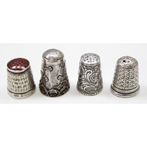 1057 - 8 assorted silver thimbles, all either hallmarked or XRF tested and a silver propelling pencil, Lond... 