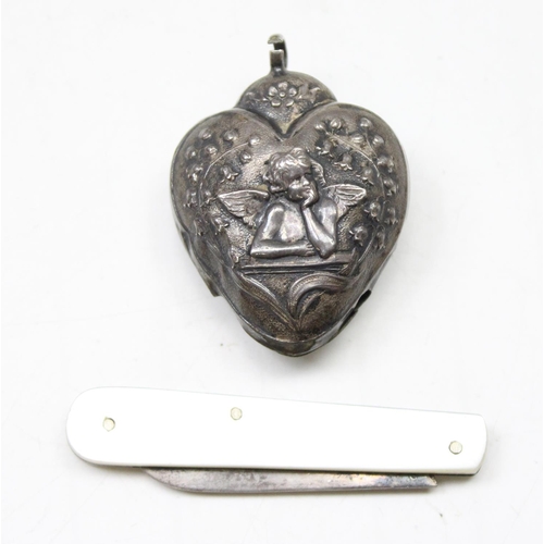 1059 - A small silver bladed fruit knife, Sheffield 1898 and a small silver heart shaped bell, lacking bell