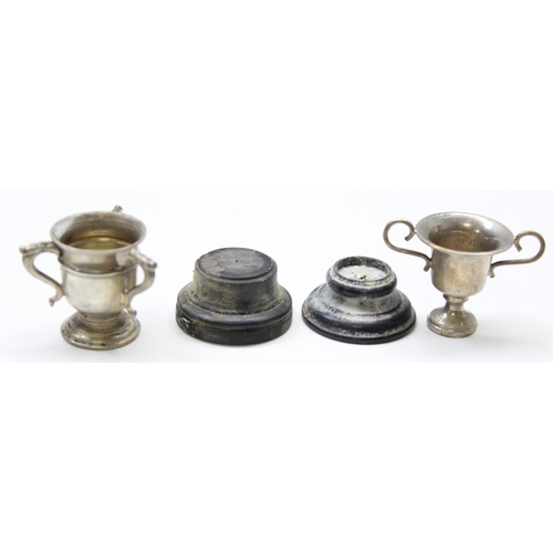 1060 - 2 miniature silver trophies, Birmingham 1907 & 1909, the largest approx 45mm tall inc base