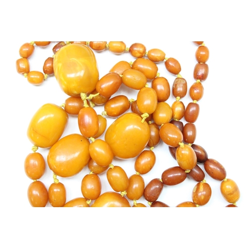 1174 - A large vintage amber coloured bead necklace, believed to be Amber on individually strung and knotte... 