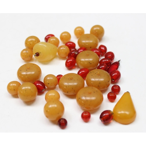 1176 - Qty of assorted loose beads, amber coloured but some believed to be amber, various colours and sizes... 