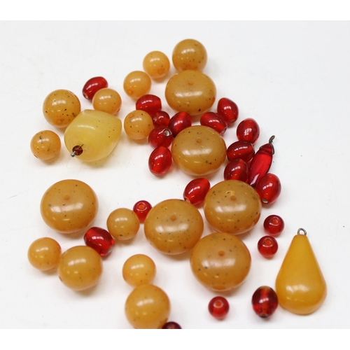 1176 - Qty of assorted loose beads, amber coloured but some believed to be amber, various colours and sizes... 