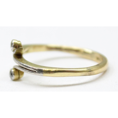 1185 - A 15ct gold ring set with 2 small diamonds in crossover setting, mark obscured but XRF tested at 15c... 