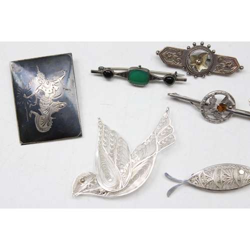 1193 - 6 antique and vintage silver brooches, a silver part Albert chain and a silver and gold plated cruci... 