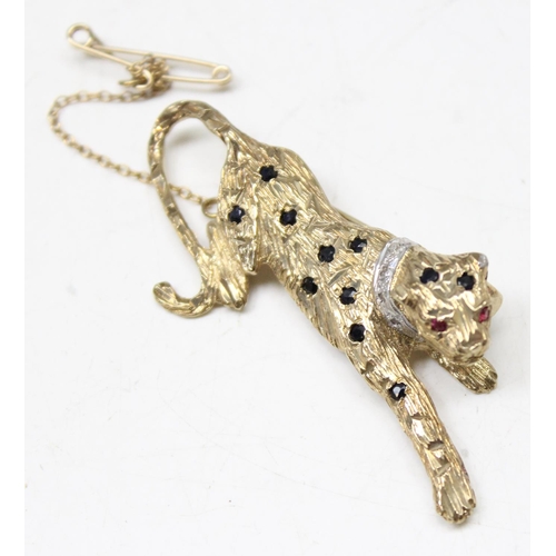 1195 - Retro 9ct gold brooch formed as a leopard set with small blue sapphires and diamond chip collar, mar... 