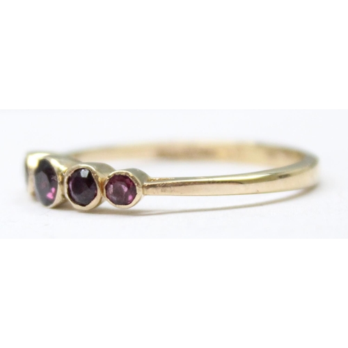 1196 - A 9ct gold ring set with 5 amethysts, full English marks for Birmingham 1992, approx size S, approx ... 