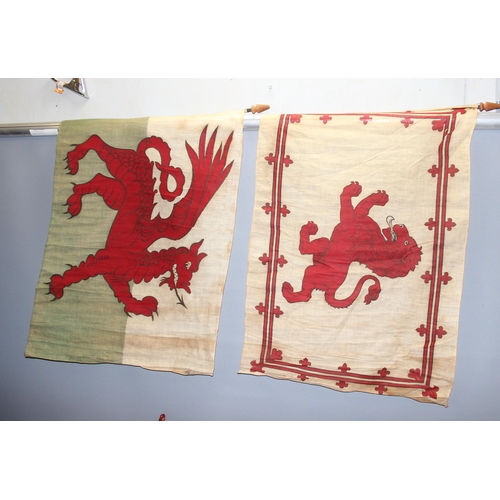 1414B - 11 vintage parade flags on canes to include Royal banner of Scotland, Welsh dragon flag (some hand p... 