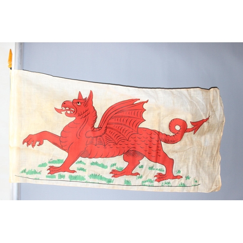 1414B - 11 vintage parade flags on canes to include Royal banner of Scotland, Welsh dragon flag (some hand p... 